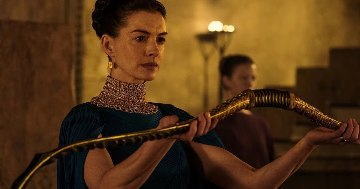 A still from The Odyssey showing a woman holding a weapon.
