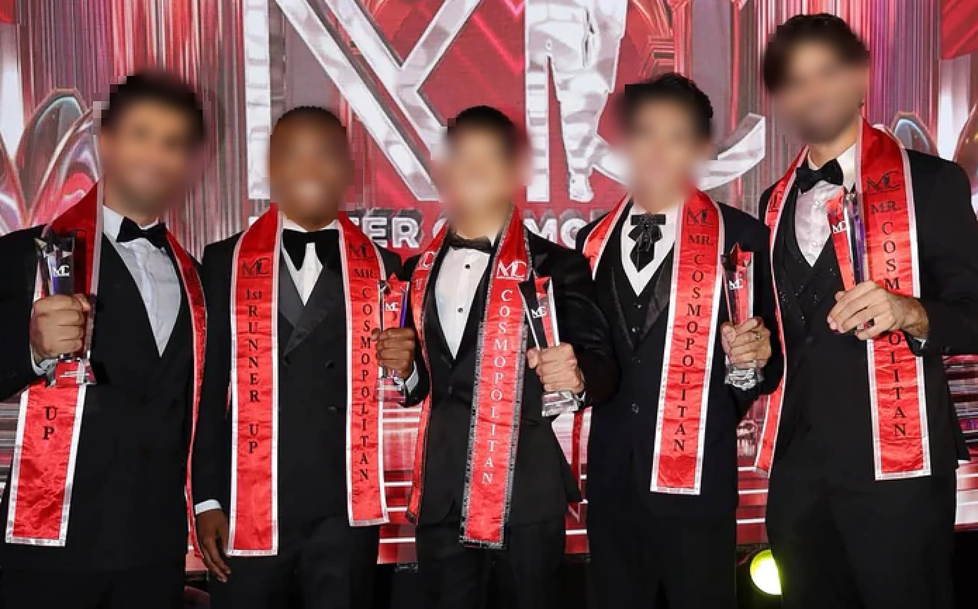 The source article's photograph of Mister Cosmopolitan contestants, retaining its original face blurring.