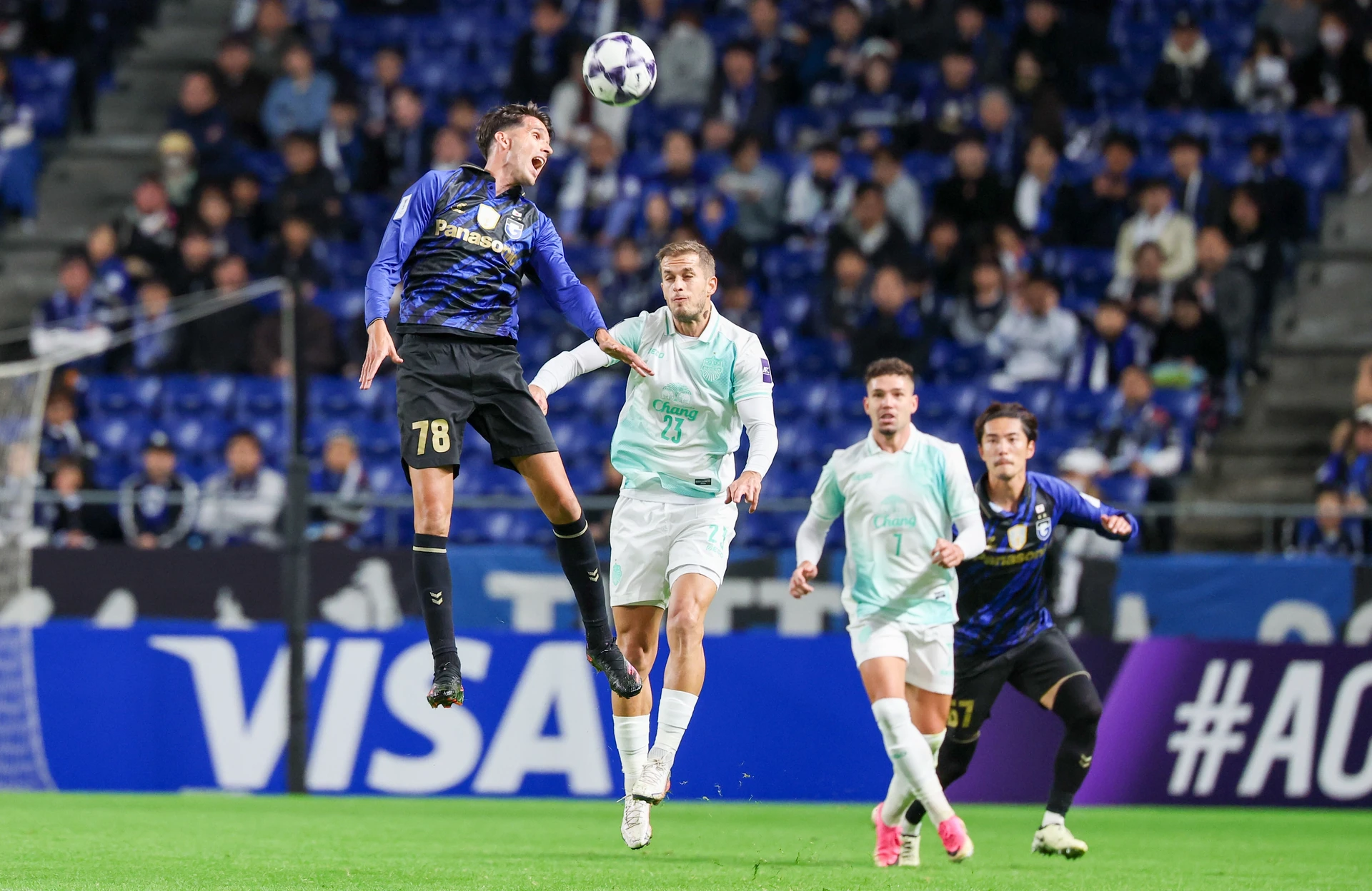 Gamba Osaka and Buriram United players contest a header during their 1-1 draw in the AFC Champions League Elite.