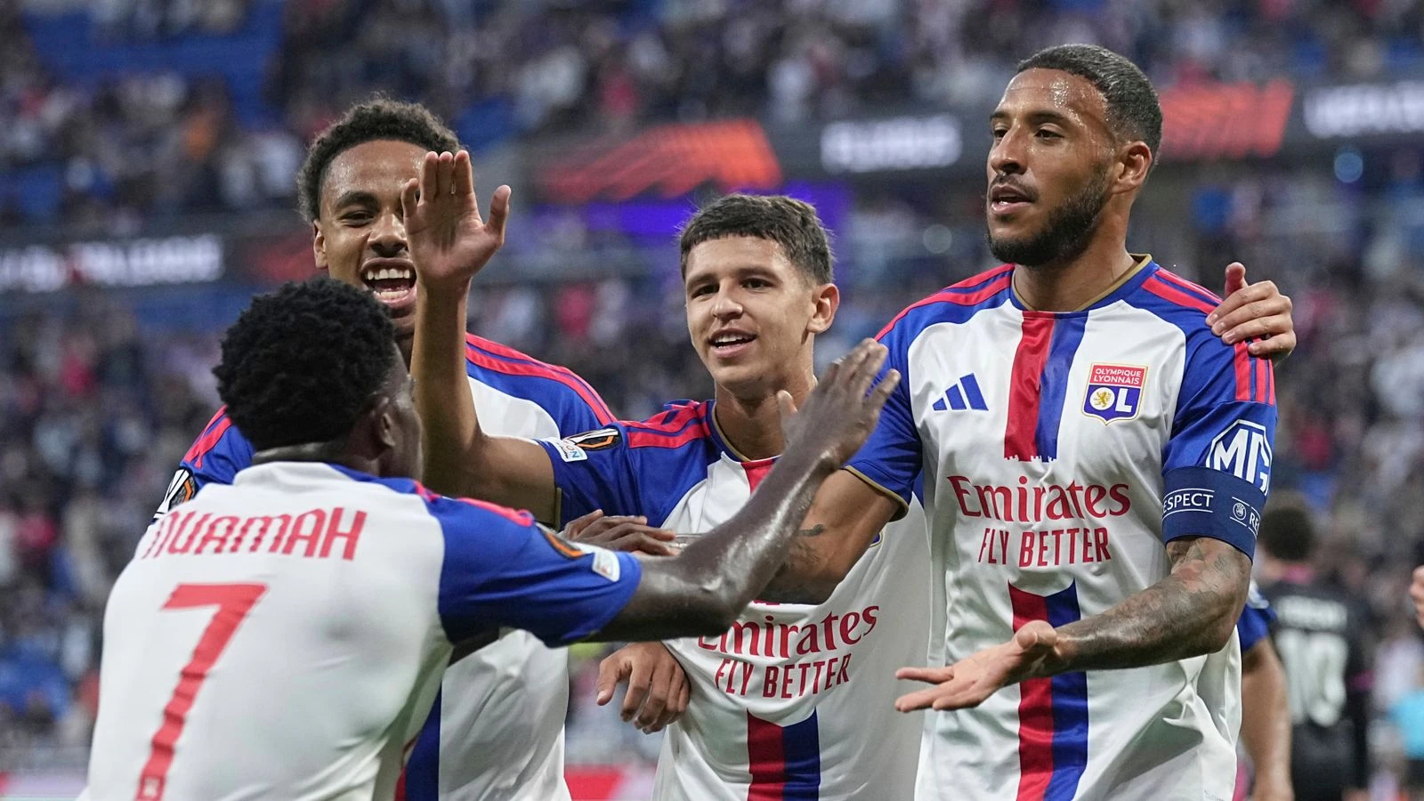 Lyon players celebrate during the match against Crystal Palace.