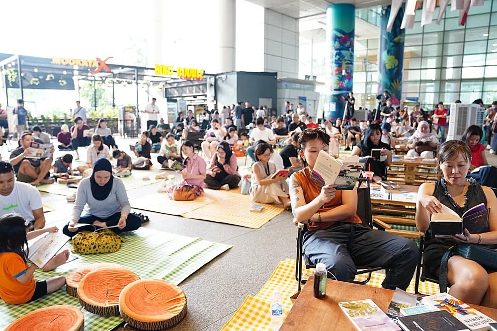 People take part in the ReadSG launch event at Singapore's National Library.