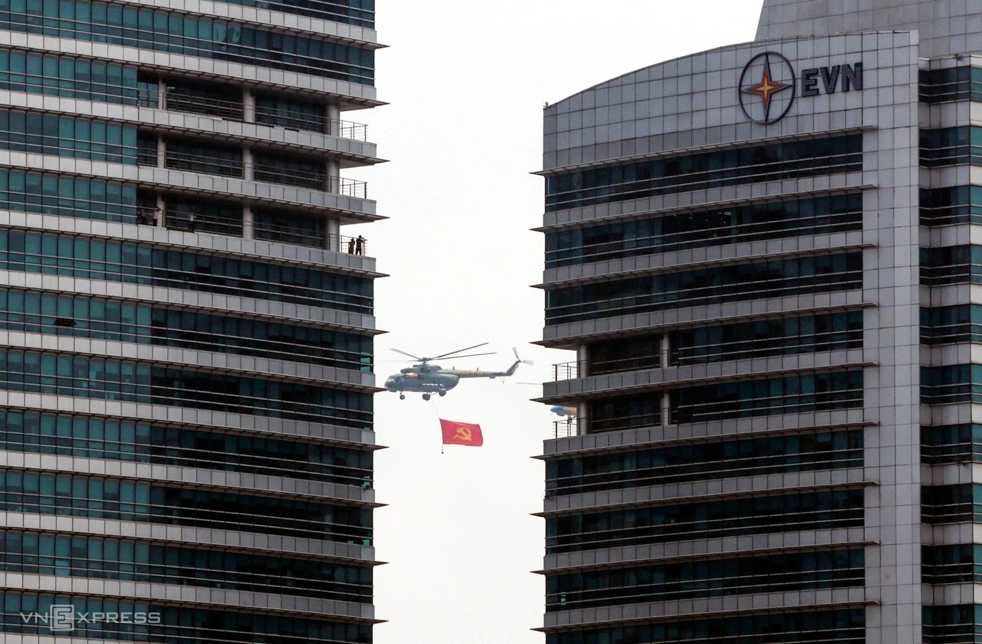 A helicopter flies past the EVN building in September 2025.