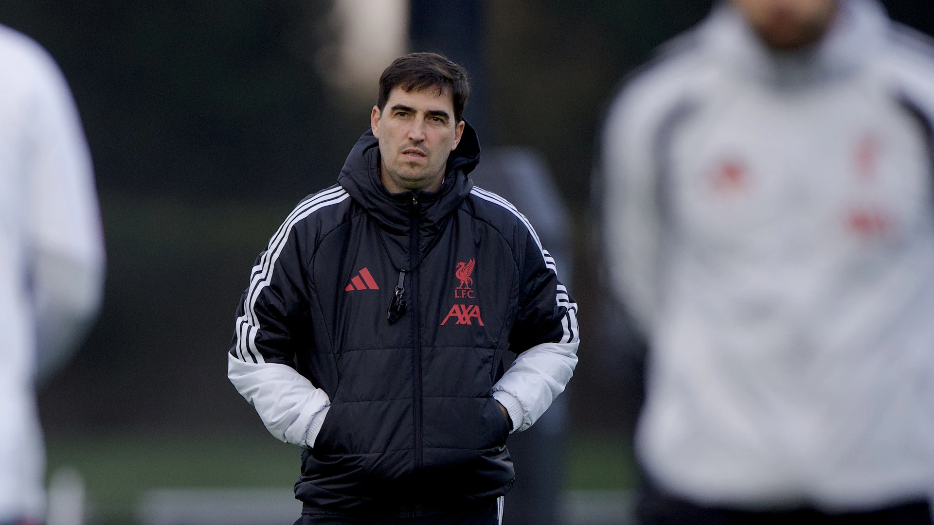 Liverpool head coach Andoni Iraola watches a training session ahead of the Carabao Cup tie against Chelsea.