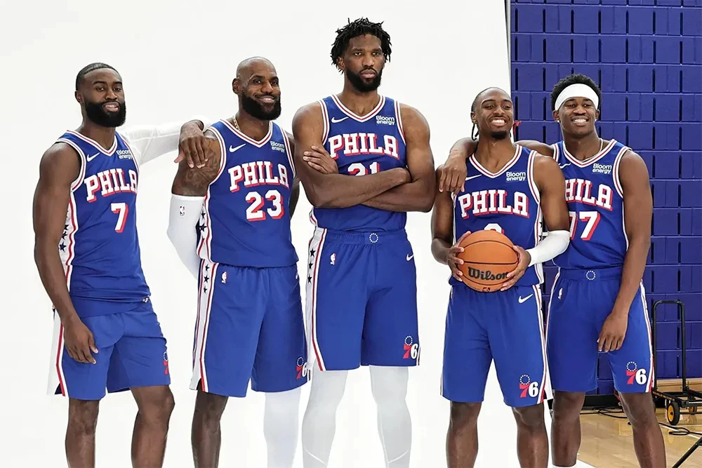 Joel Embiid with LeBron James and their teammates in a 76ers photograph, not a scene of the alleged confrontation.