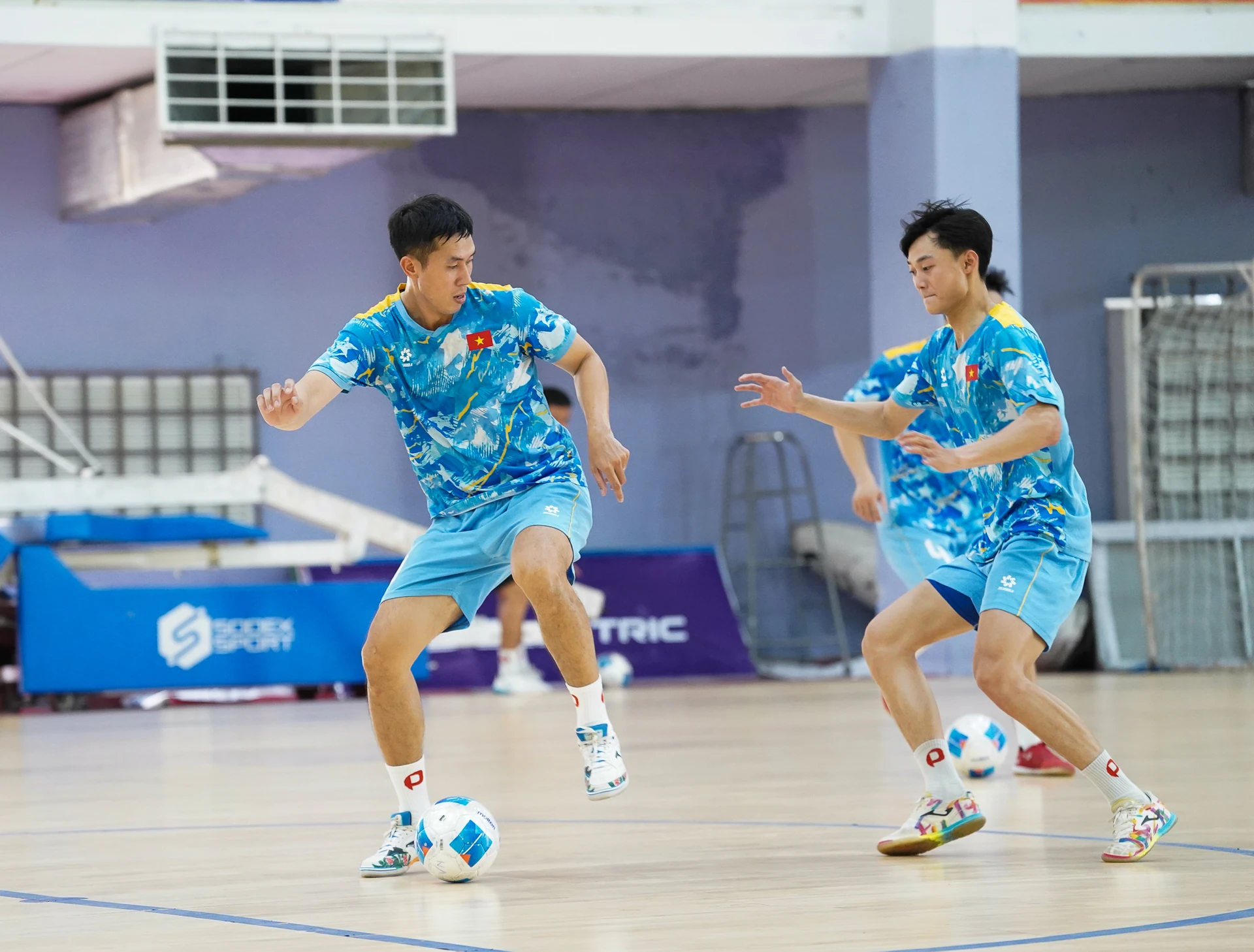 Vietnam national futsal team players during a training session.