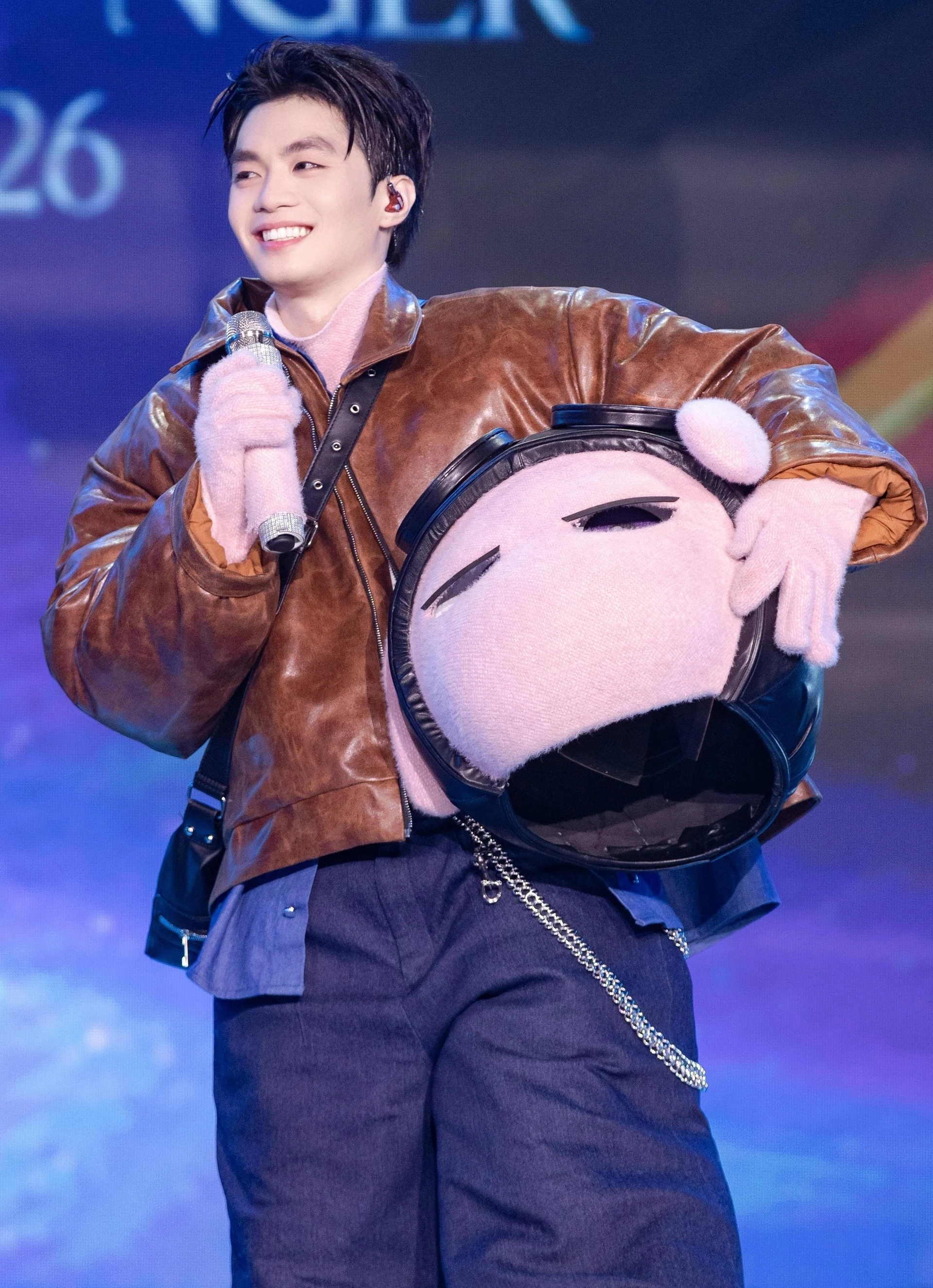 Negav holds his mask after being unmasked on The Masked Singer Vietnam 2026