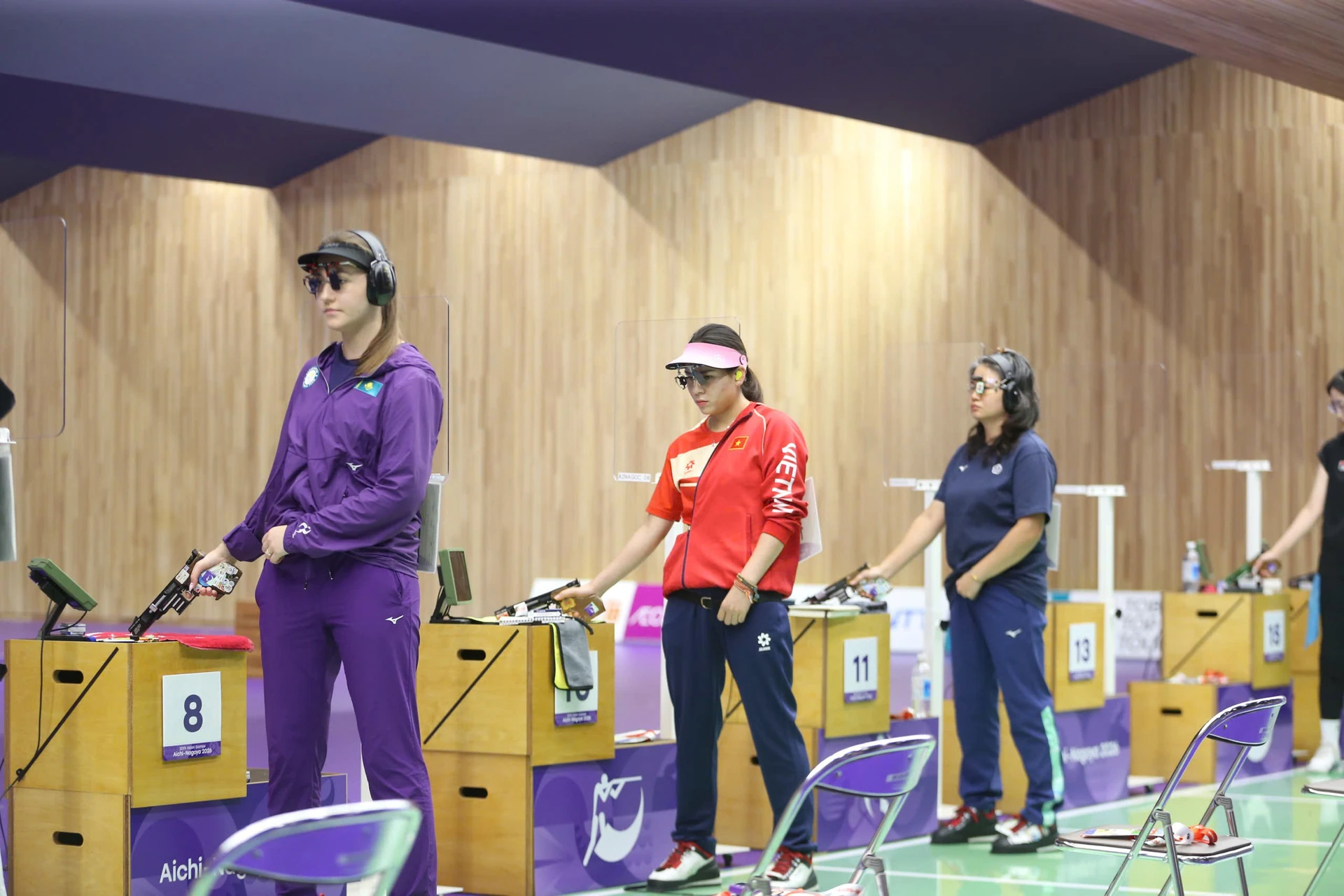 Trinh Thu Vinh, centre, with other shooters at the 20th Asian Games; related photograph.