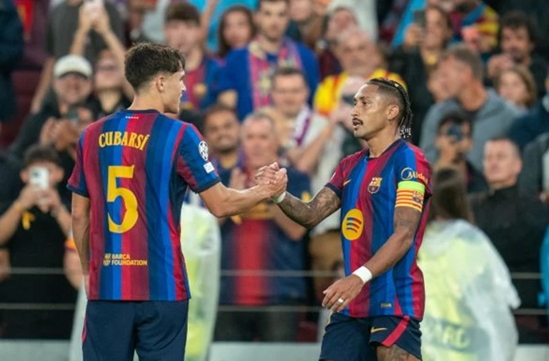 Barcelona captain Raphinha (right) on the pitch.