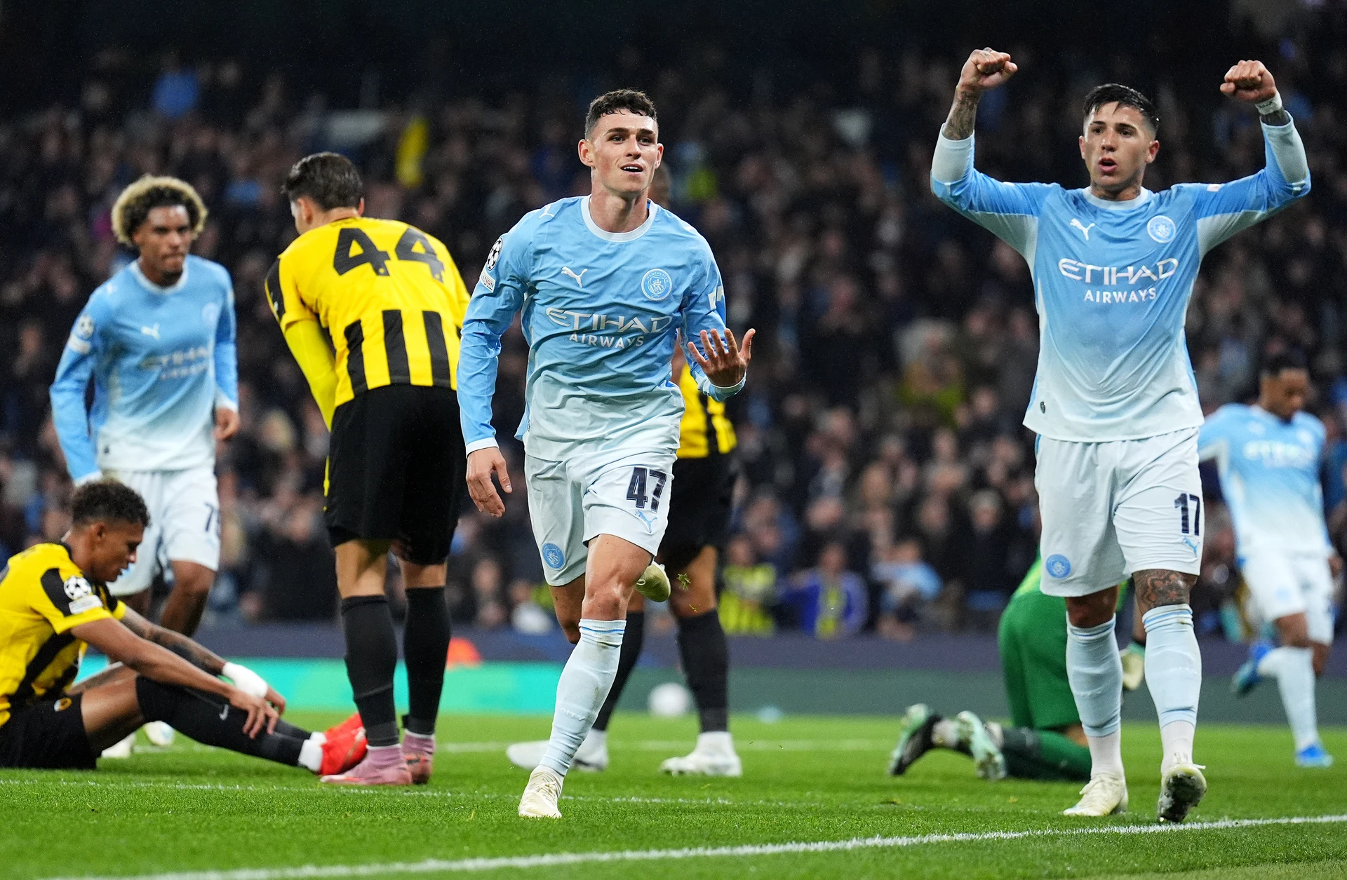 Phil Foden runs away to celebrate after scoring against AEK Athens at the Etihad Stadium.