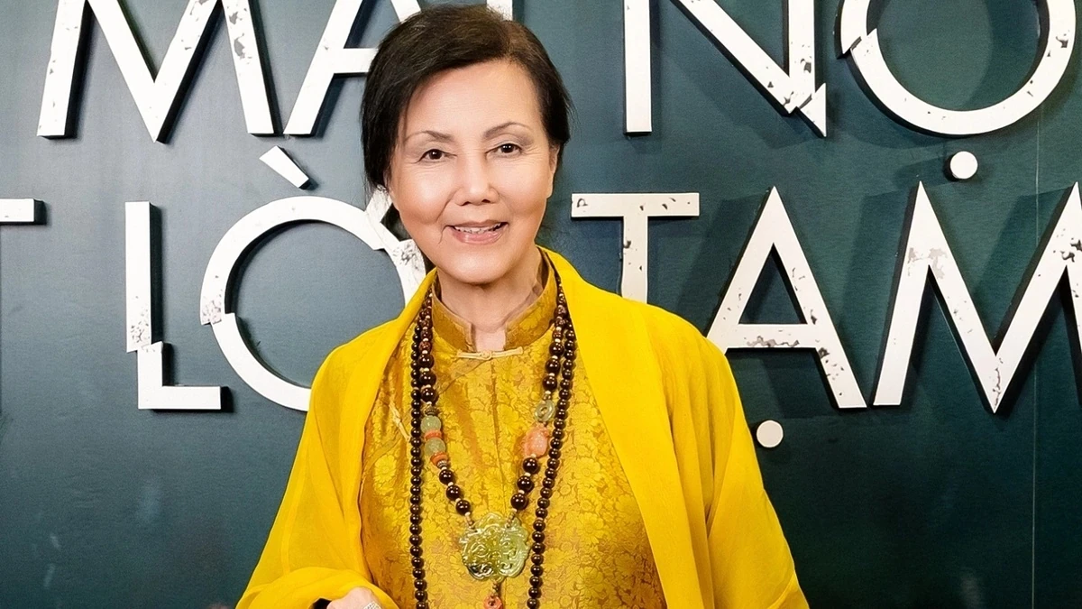 Actor Kiều Chinh wearing yellow