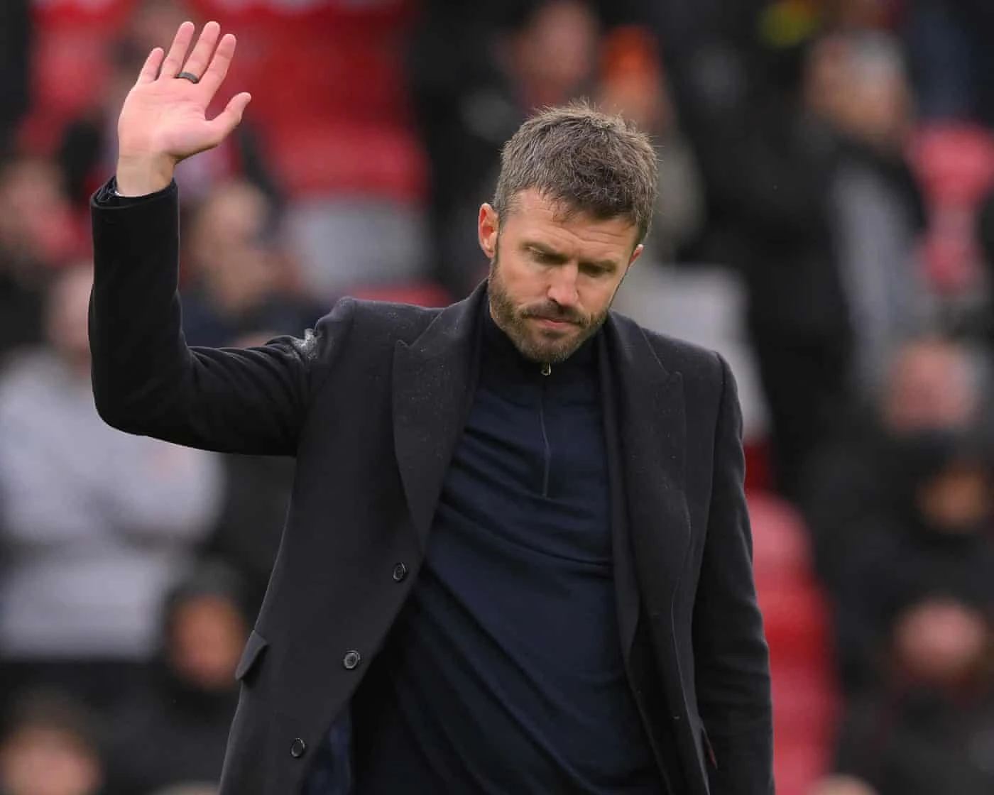Michael Carrick raises his hand after Manchester United's 3-0 home defeat by Bournemouth at Old Trafford