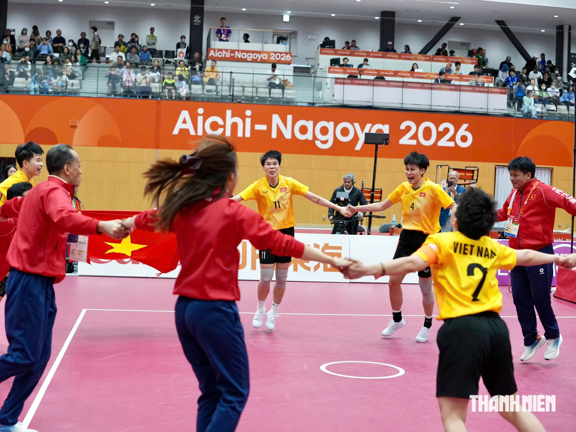 Vietnam's sepak takraw team celebrates at the Asian Games; related photograph.